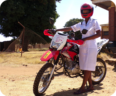A nurse standing beside her motorbike in Malawi